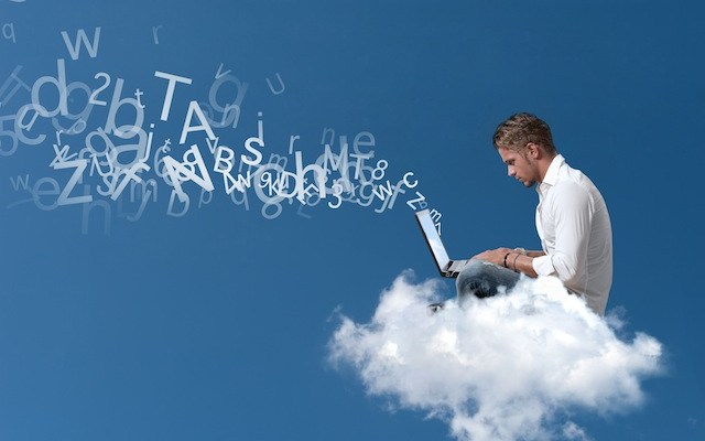 Businessman works over a cloud